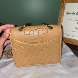 Perfect Brown Tory Burch crossbody with gold chains.